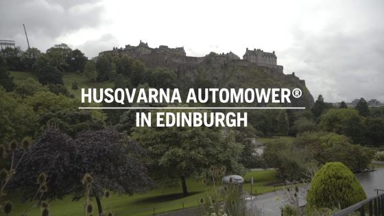 husqvarna automower robot mowing in city public area